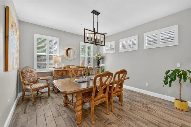 a bedroom with furniture and a flat screen tv