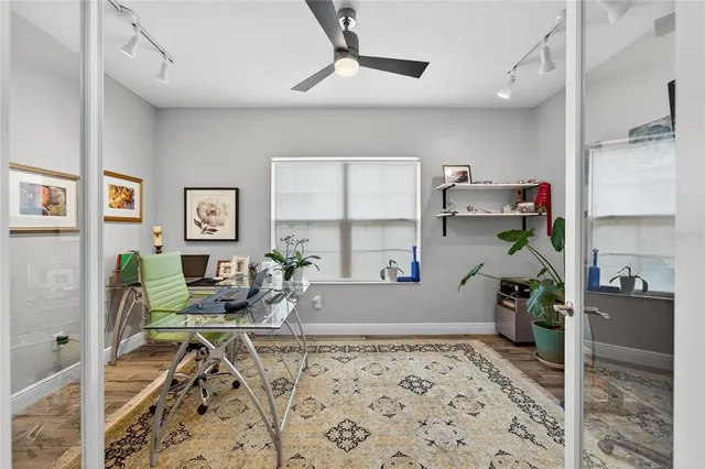 a view of a livingroom with furniture and a flat screen tv