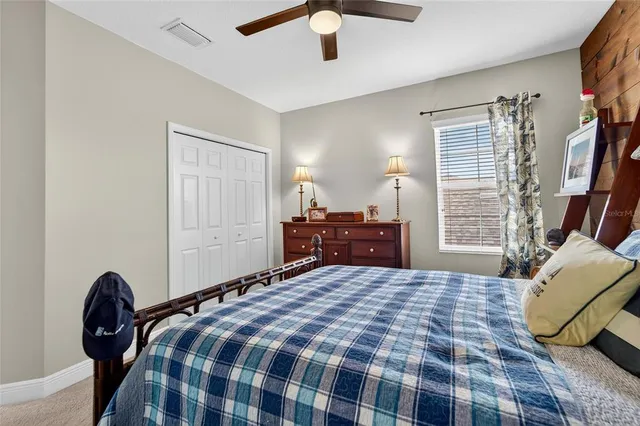 a view of a porch with wooden floor and furniture