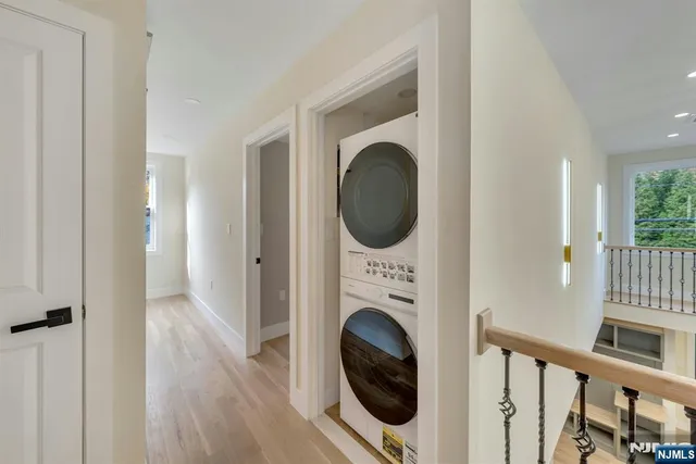 a view of a hallway with washer and dryer