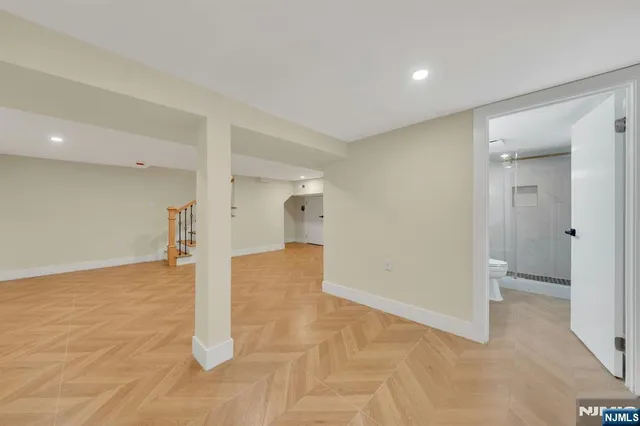 a view of a big room with closet and wooden floor