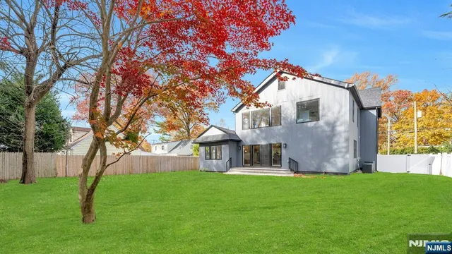 a view of house with backyard