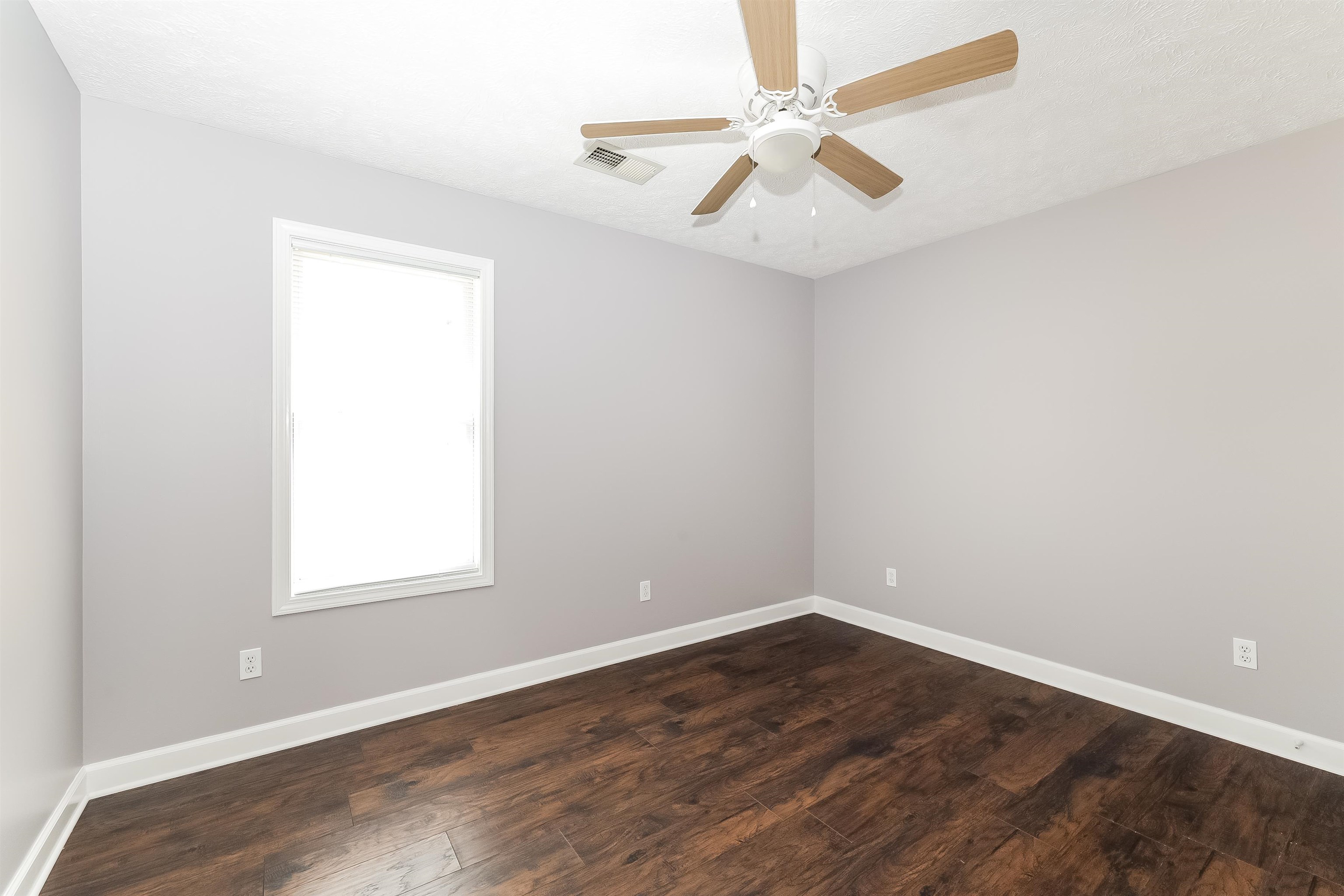 97 Jadewood Drive Jackson, TN 38305 - Photo 12 of 16 an empty room with a window and a fan