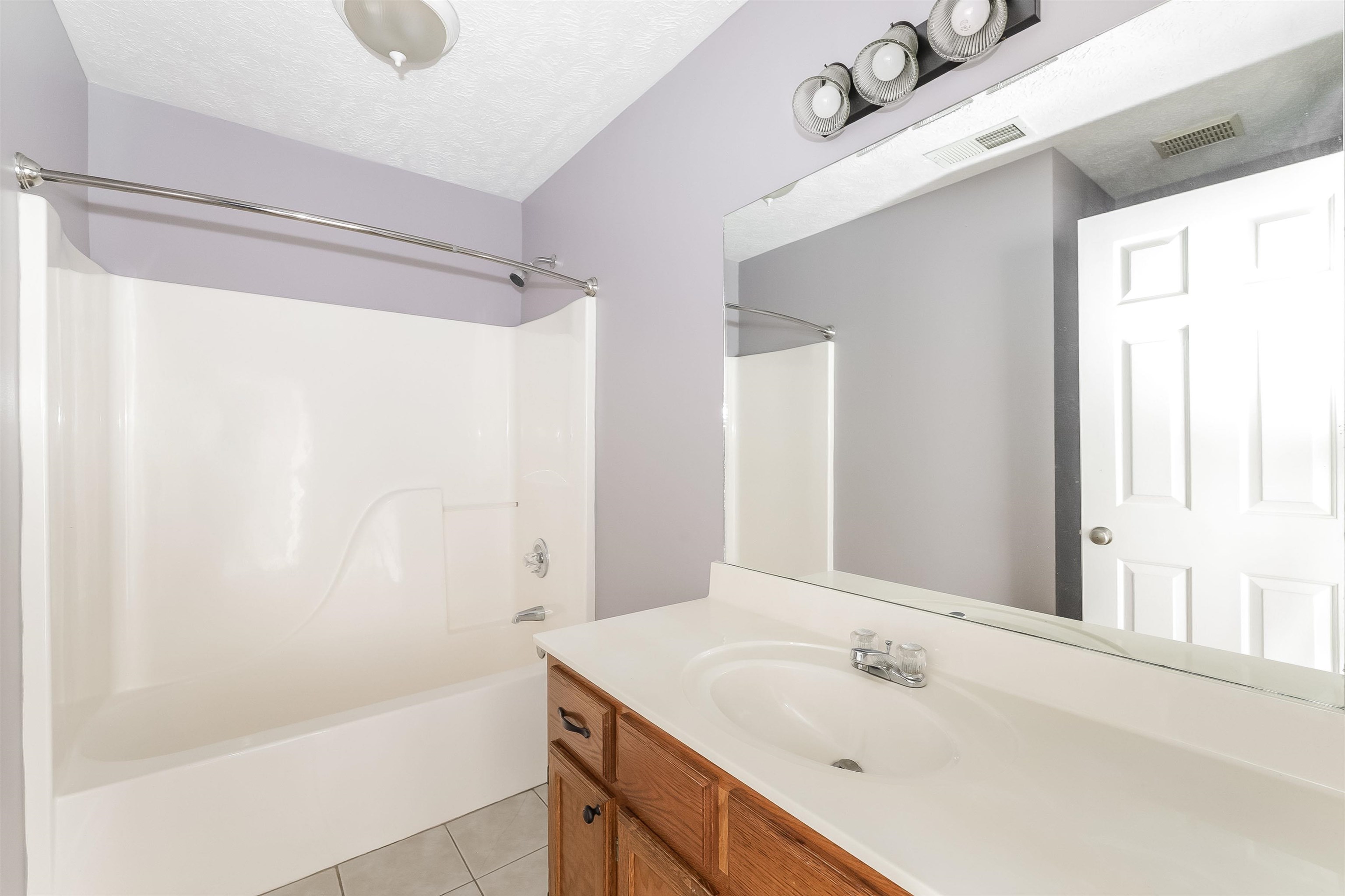 97 Jadewood Drive Jackson, TN 38305 - Photo 13 of 16 a bathroom with a sink and a mirror