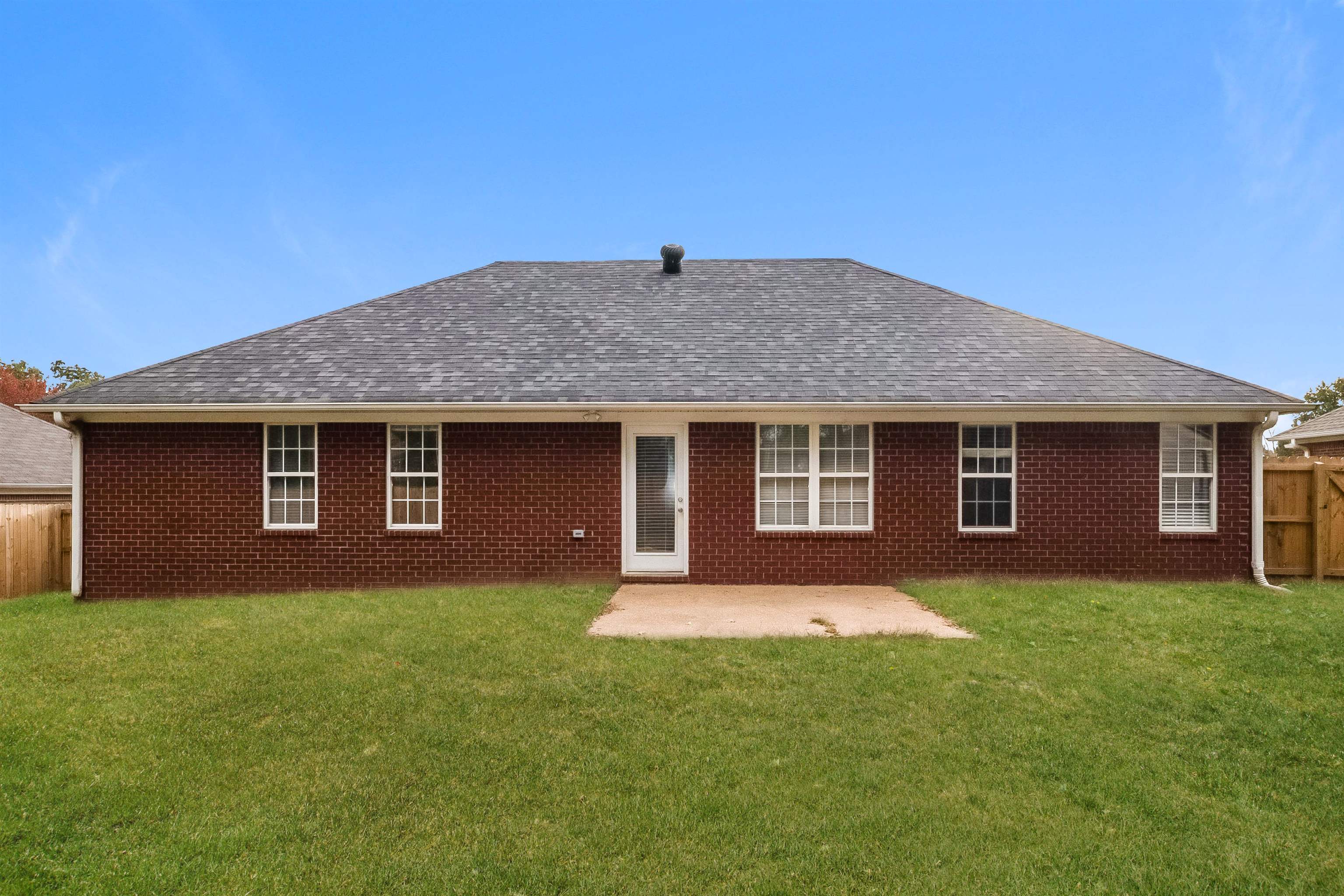 97 Jadewood Drive Jackson, TN 38305 - Photo 14 of 16 a front view of a house with a yard