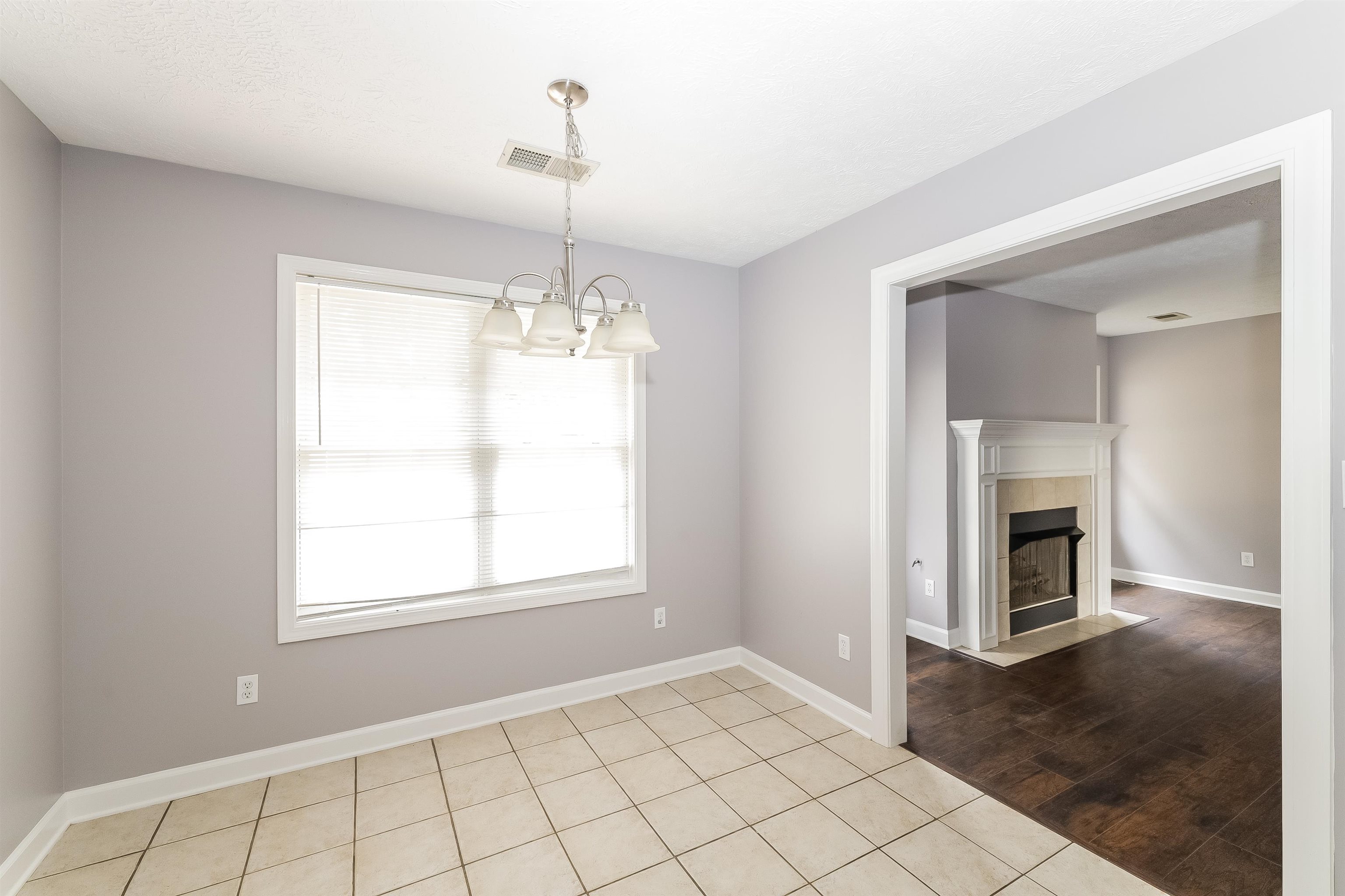 97 Jadewood Drive Jackson, TN 38305 - Photo 5 of 16 a view of an empty room with a window and fire place