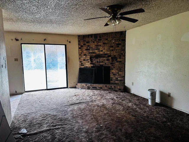 a view of empty room with windows