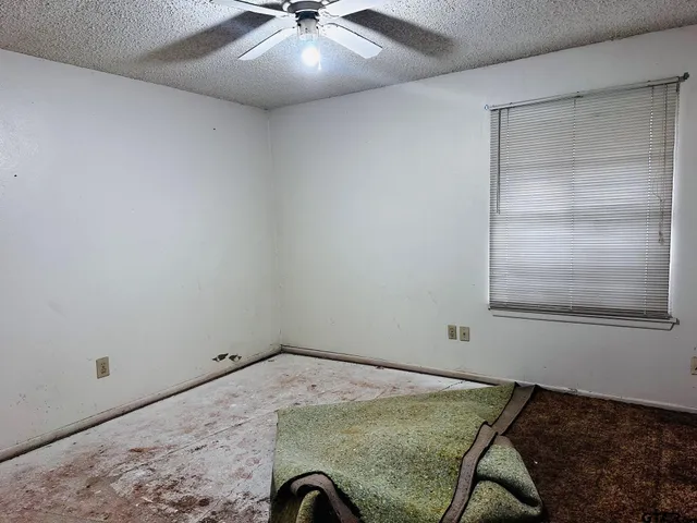 a view of a room with a air conditioner and a window