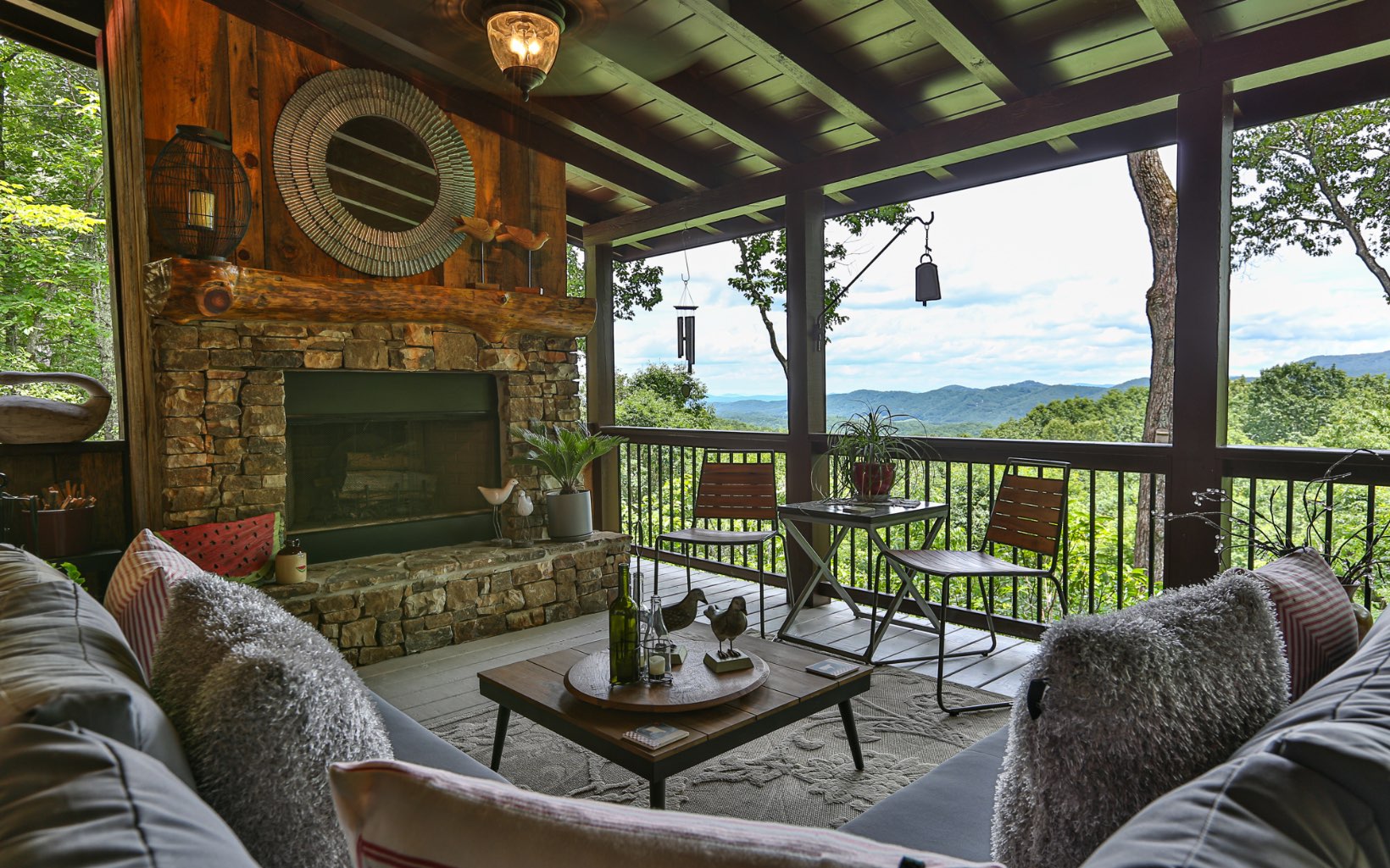 14 Little Bushy Head Road Blue Ridge, GA 30513 - Photo 1 of 1 a living room with furniture a fireplace a large window with outer view
