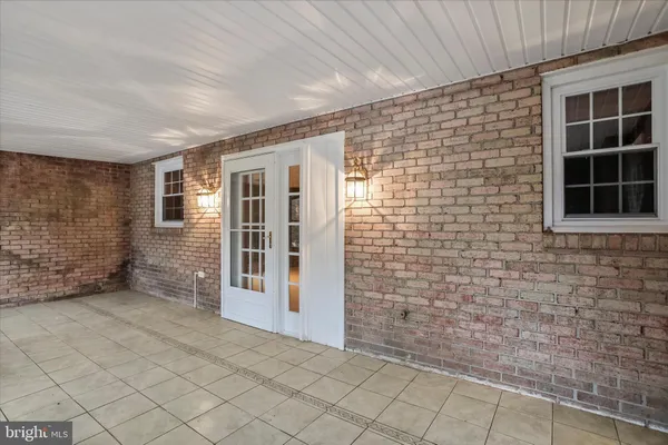 a view of front door of house with parking