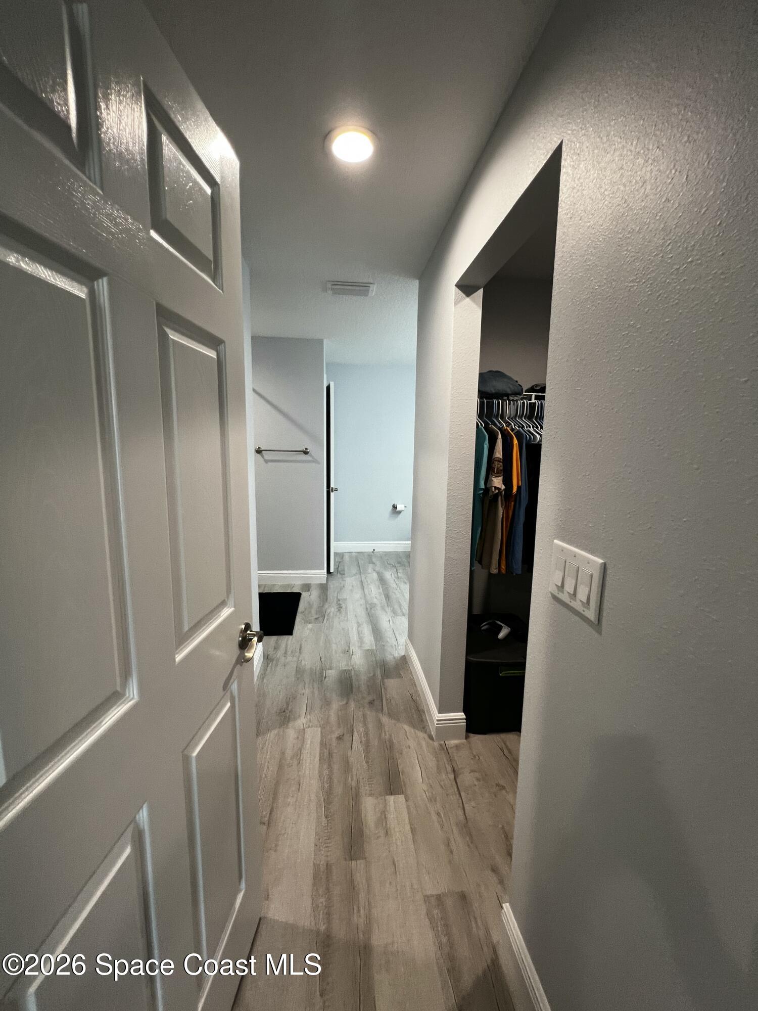 379 Wilton Avenue Southwest Melbourne, FL 32908 - Photo 12 of 26 a view of a hallway with wooden floor