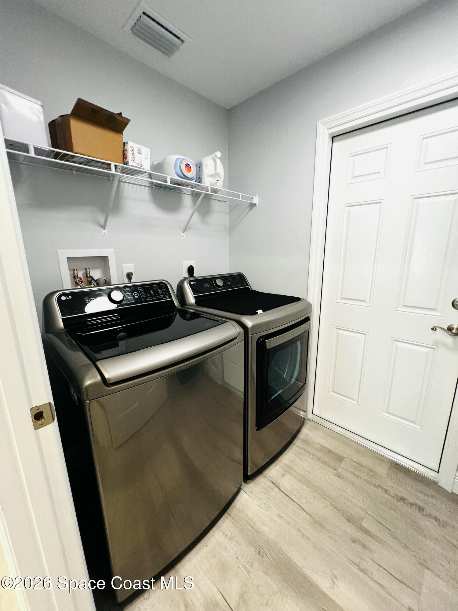 379 Wilton Avenue Southwest Melbourne, FL 32908 - Photo 22 of 26 a kitchen with a stove and a refrigerator