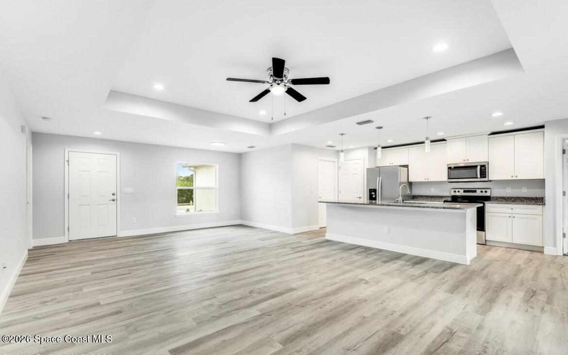 379 Wilton Avenue Southwest Melbourne, FL 32908 - Photo 5 of 26 a view of kitchen with sink microwave and stove