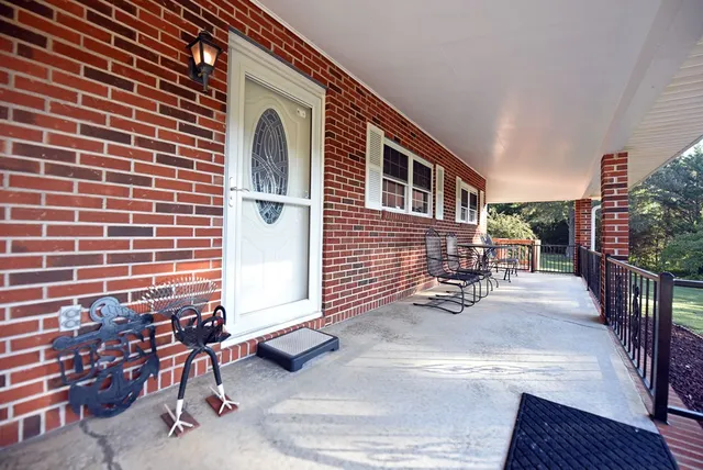 a backyard of a house with outdoor seating