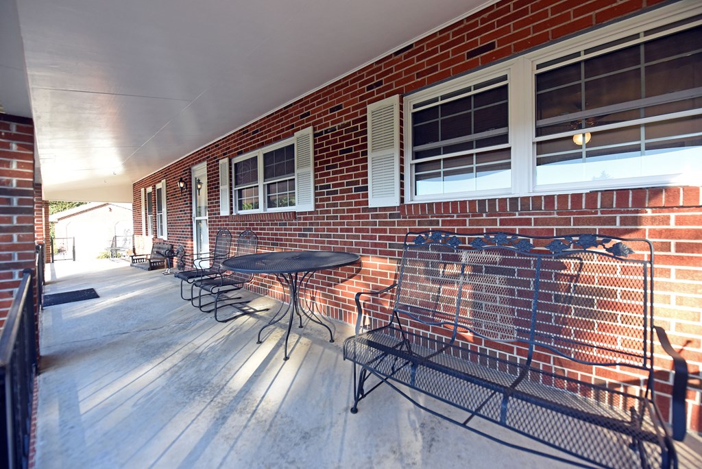 201 Coffey Road Chatsworth, GA 30705 - Photo 13 of 46 a backyard of a house with seating space