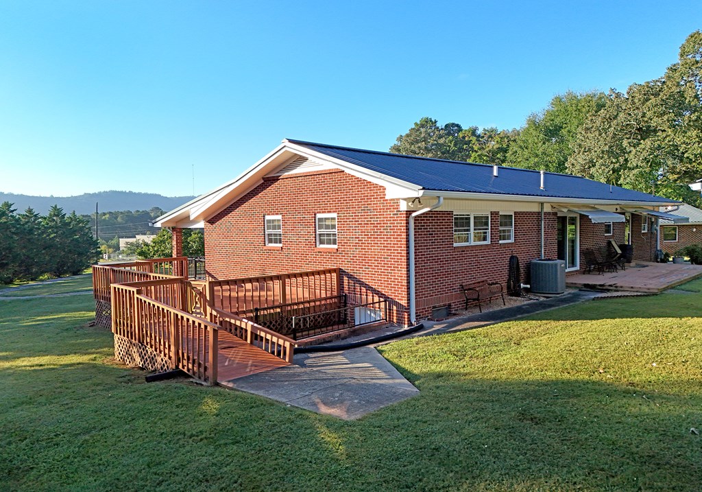 201 Coffey Road Chatsworth, GA 30705 - Photo 15 of 46 a view of a house with a yard porch and sitting area