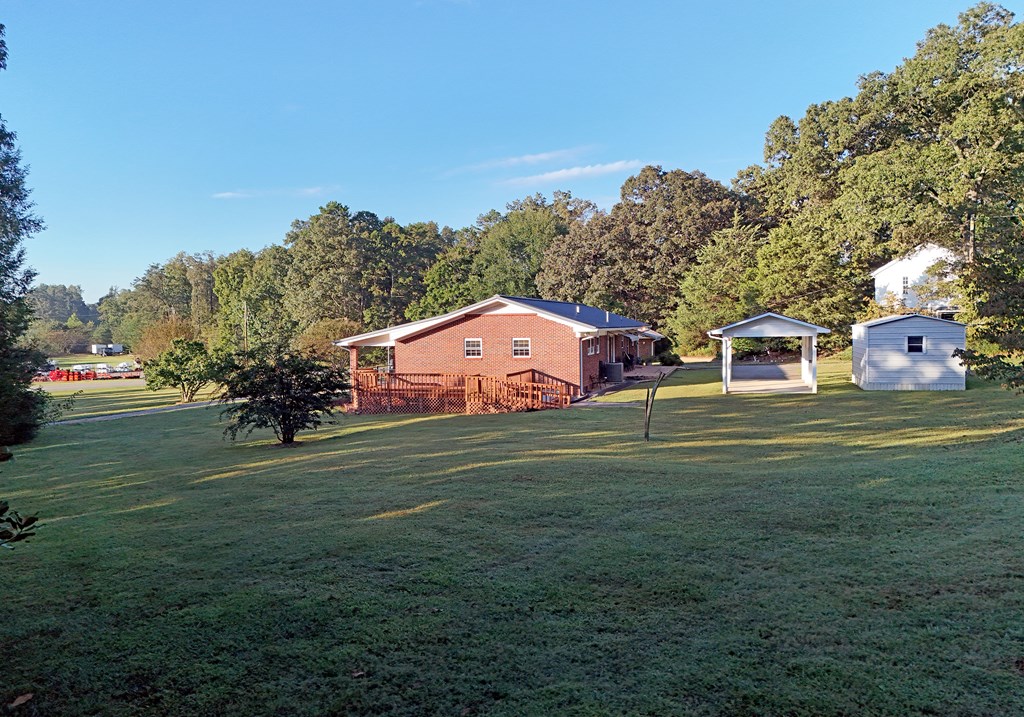 201 Coffey Road Chatsworth, GA 30705 - Photo 16 of 46 a front view of a house with a yard