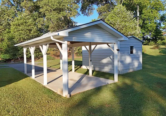 swimming pool view with a garden space