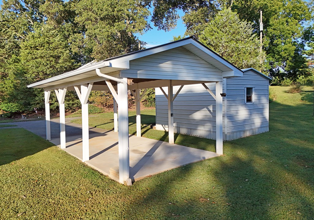201 Coffey Road Chatsworth, GA 30705 - Photo 17 of 46 swimming pool view with a garden space