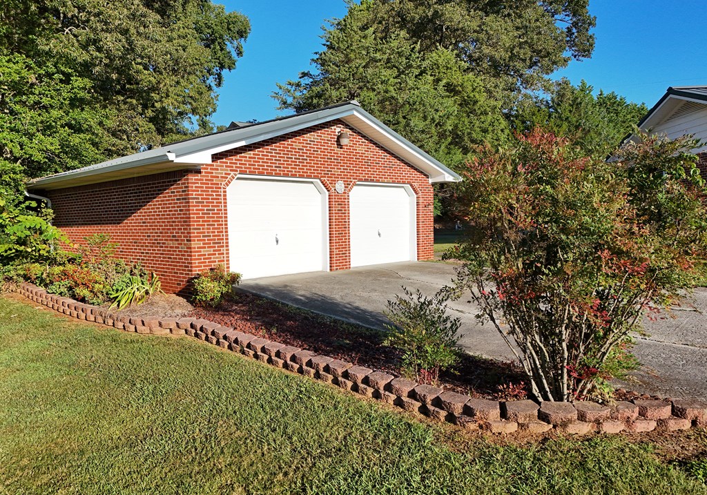 201 Coffey Road Chatsworth, GA 30705 - Photo 23 of 46 a view of a house with a yard and potted plants