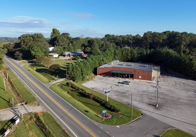 an aerial view of a house with a garden