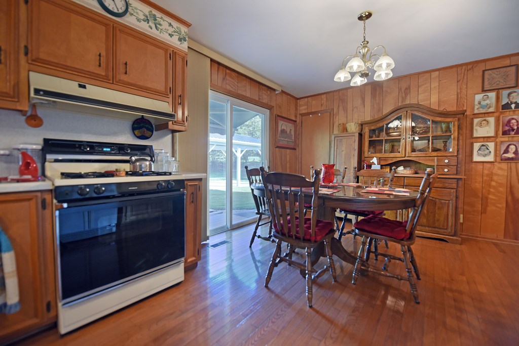201 Coffey Road Chatsworth, GA 30705 - Photo 35 of 46 a view of a dining room with furniture and chandelier