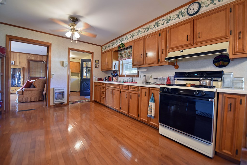 201 Coffey Road Chatsworth, GA 30705 - Photo 38 of 46 a kitchen with stainless steel appliances granite countertop a stove and cabinets
