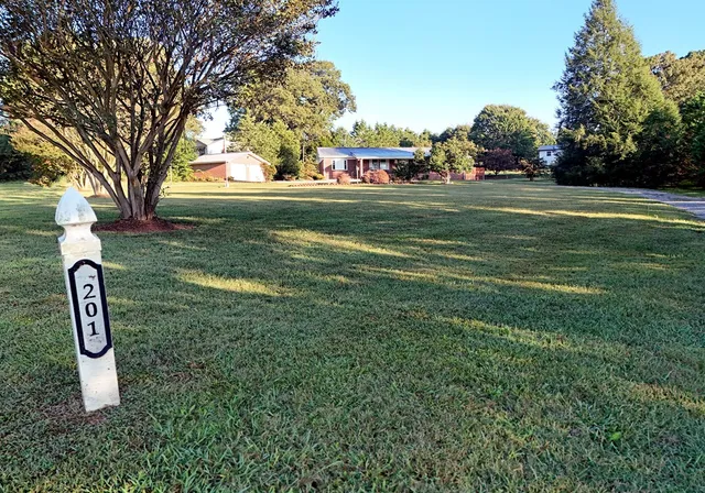 a backyard of a house with lots of green space