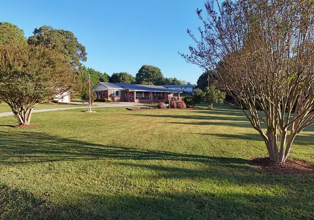 a view of a swimming pool with an outdoor space and seating area