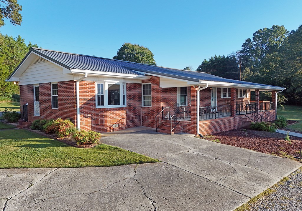 201 Coffey Road Chatsworth, GA 30705 - Photo 10 of 46 a view of a house with a yard