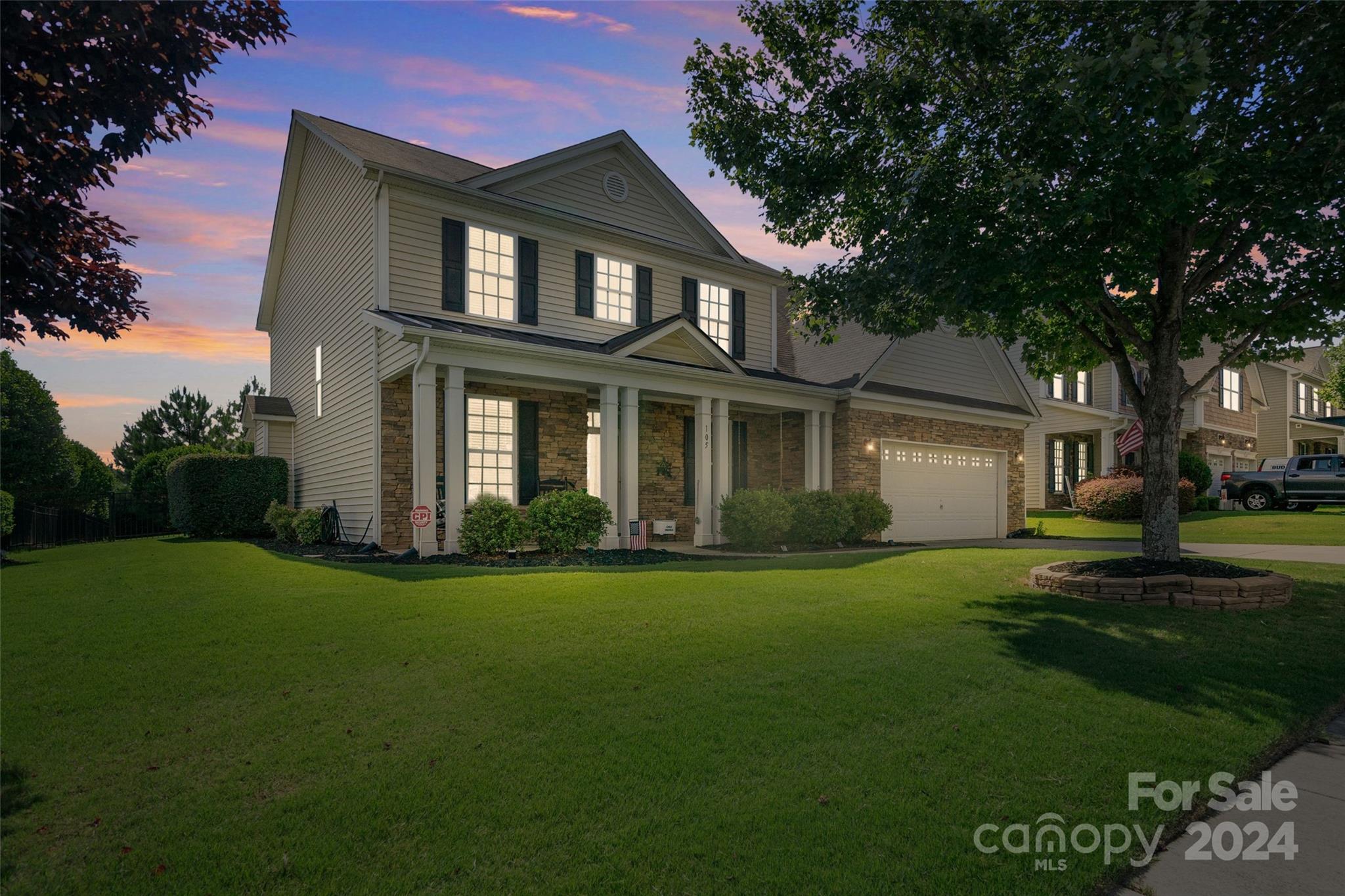 105 Annatto Way Fort Mill, SC 29708 - Photo 1 of 32 a front view of a house with a garden