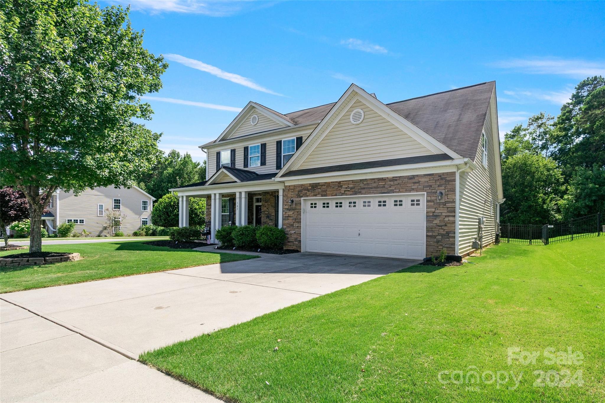 105 Annatto Way Fort Mill, SC 29708 - Photo 3 of 32 a front view of a house with a yard and garage