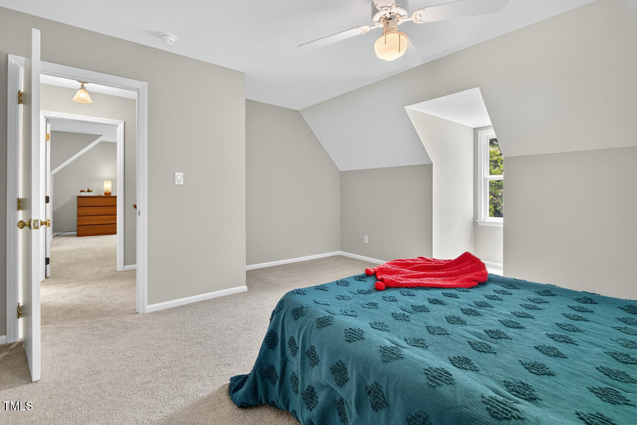 1500 Valley Run Durham, NC 27707 - Photo 25 of 29 a bedroom with a bed and a chandelier