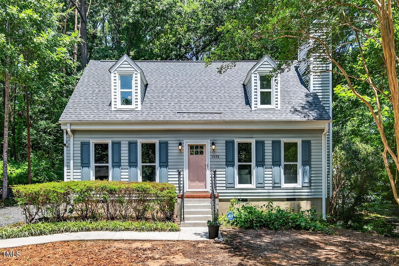 1500 Valley Run Durham, NC 27707 - Photo 3 of 29 a front view of a house with garden