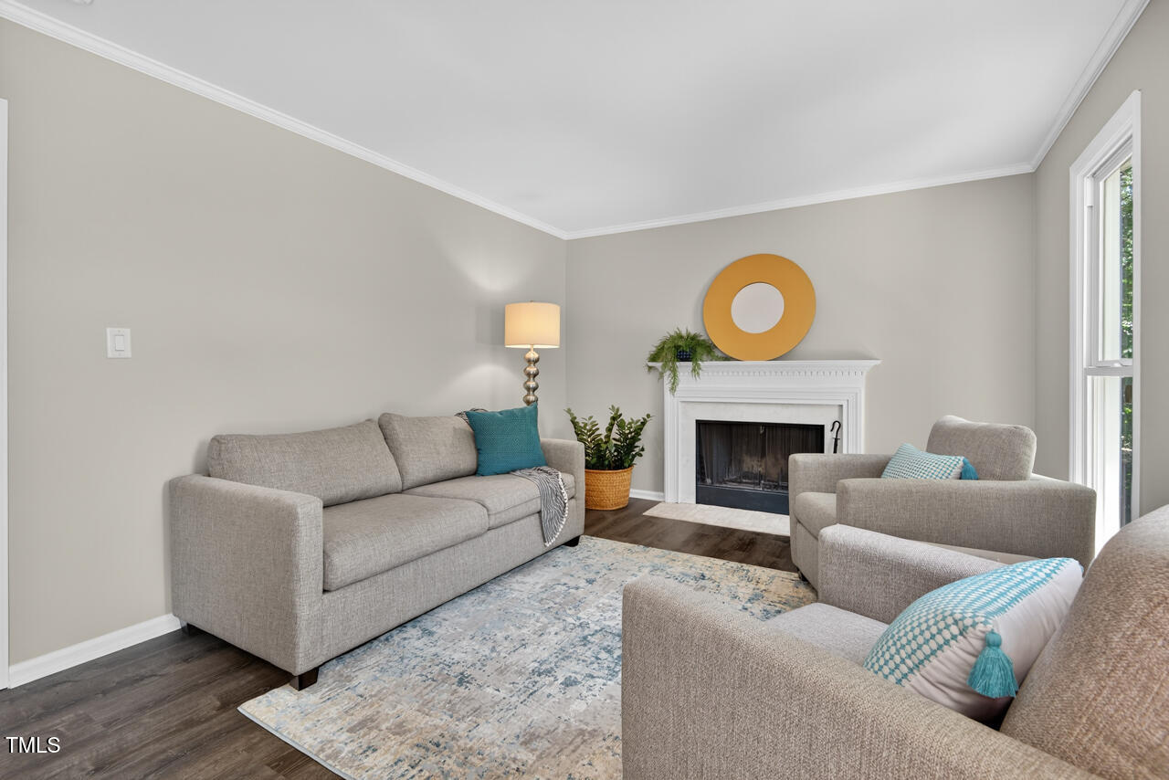1500 Valley Run Durham, NC 27707 - Photo 4 of 29 a living room with furniture a fireplace and a window