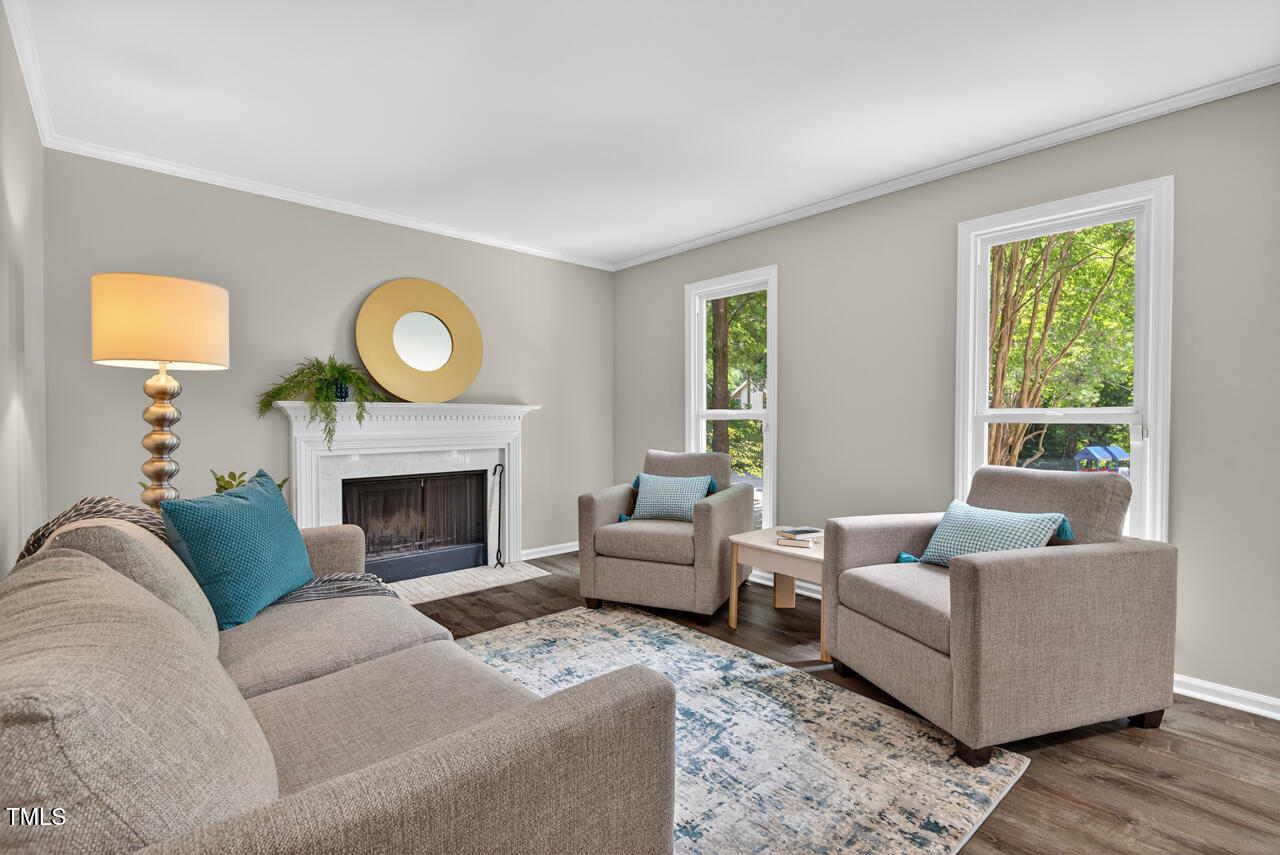 1500 Valley Run Durham, NC 27707 - Photo 5 of 29 a living room with furniture a fireplace and a large window