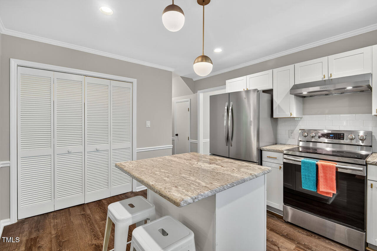1500 Valley Run Durham, NC 27707 - Photo 8 of 29 a kitchen with a stove and a refrigerator
