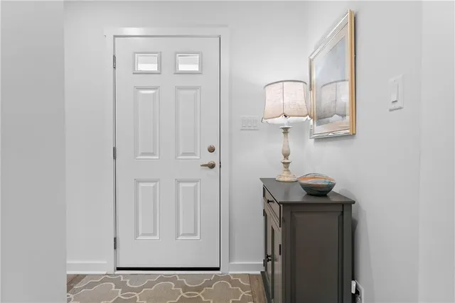 a view of a hallway with front door