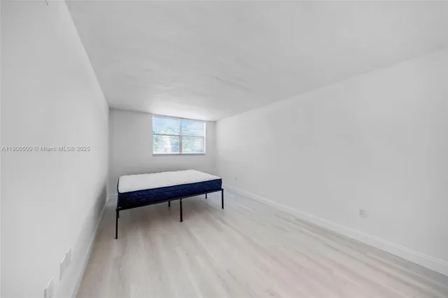 a room with a bed and a window