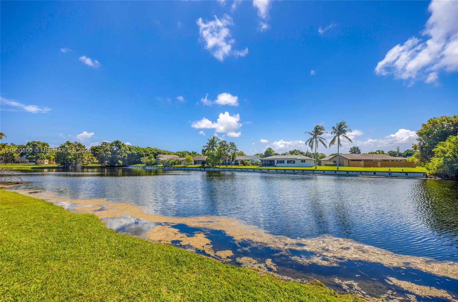 9090 Lime Bay Boulevard, Unit 211 Tamarac, FL 33321 - Photo 2 of 23 a view of a lake with a mountain