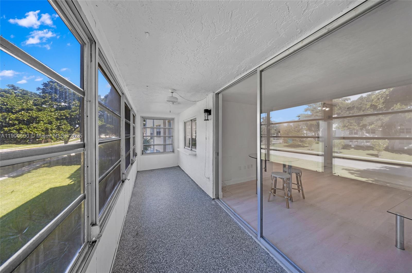 9090 Lime Bay Boulevard, Unit 211 Tamarac, FL 33321 - Photo 23 of 23 a view of an entryway with wooden floor
