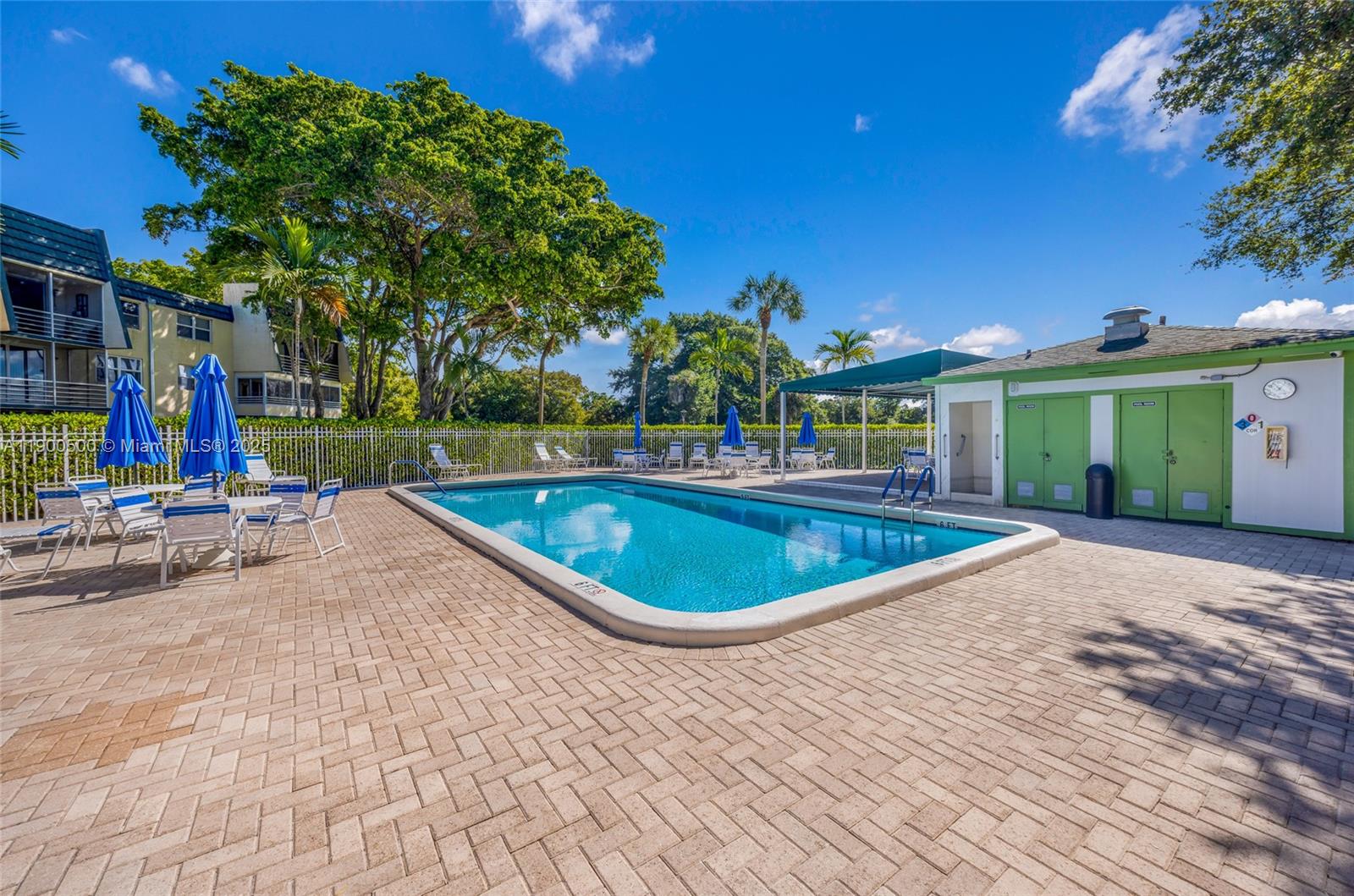 9090 Lime Bay Boulevard, Unit 211 Tamarac, FL 33321 - Photo 3 of 23 a view of outdoor space yard and swimming pool