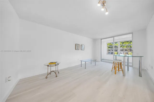 a view of dining room with furniture and a wooden floor