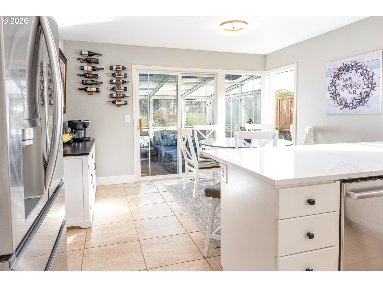 38 Denmark Loop Silverton, OR 97381 - Photo 15 of 47 a living room with stainless steel appliances kitchen island granite countertop a sink and cabinets