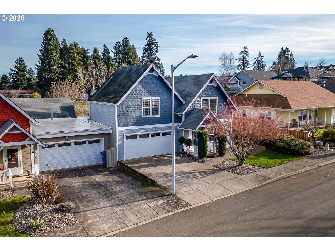 38 Denmark Loop Silverton, OR 97381 - Photo 27 of 47 a view of a big house with wooden fence