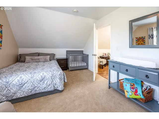a bedroom with a bed and cabinets