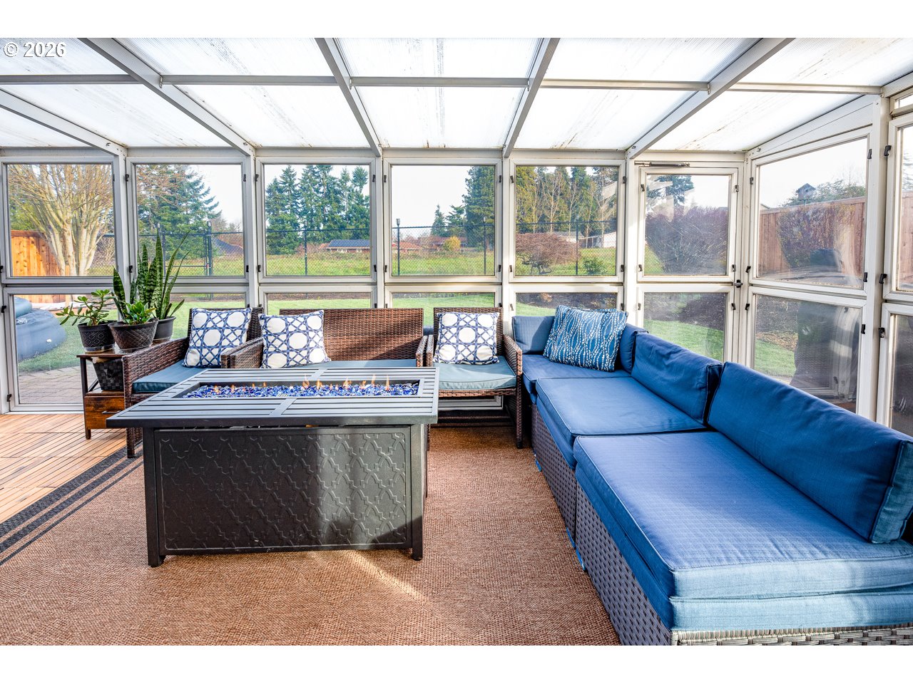 38 Denmark Loop Silverton, OR 97381 - Photo 31 of 47 a living room with furniture and a floor to ceiling window