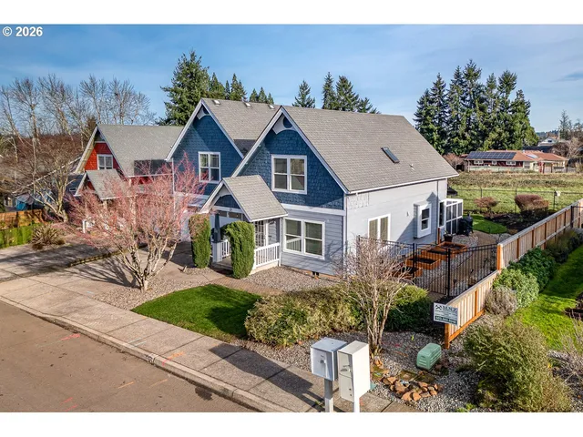 a aerial view of a house with a yard