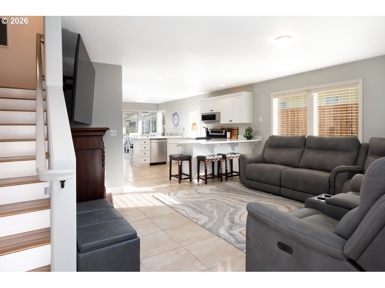 38 Denmark Loop Silverton, OR 97381 - Photo 8 of 47 a living room with furniture a fireplace and a flat screen tv