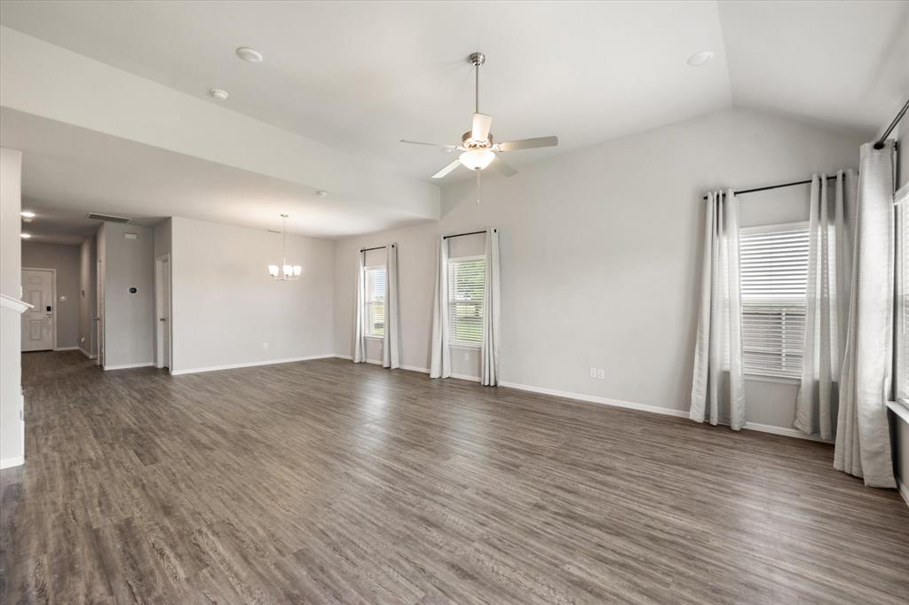 6910 Prairieside Trail Venus, TX 76084 - Photo 10 of 40 Same photo of the spacious living area looking back towards the entryway.